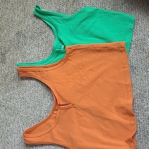 size xs (green) and size s (orange) target wild fable tank tops